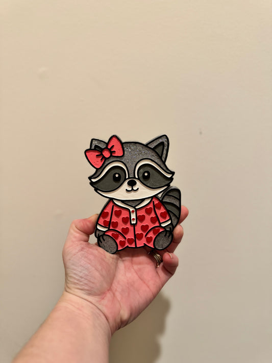 Racoon in pink PJs